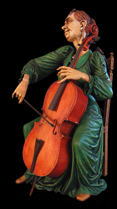 Cellist, sculpture of a cello player, wood carving by Fred Zavadil, caricatures