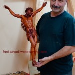 Fred showing custom carved sculpture of Jesus. Stained basswood