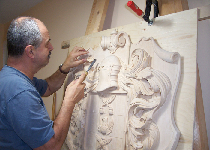 Fred carving family crest for a client