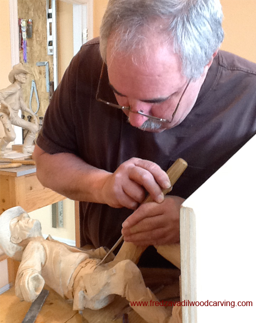 Gary working on his cowboy - you can see his clay model behind him