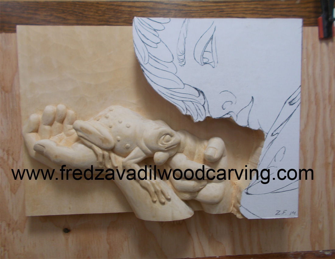 Boy with a frog, woodcarving by Fred Zavadil