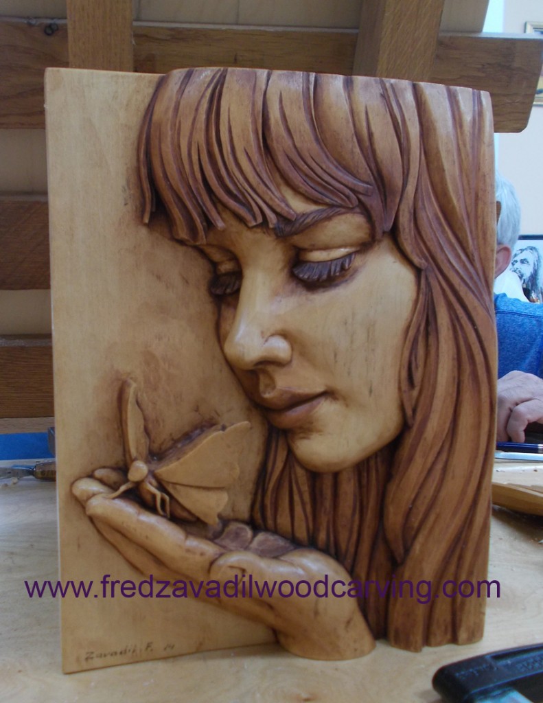 relief wood carving, fred zavadil basswood, girl with a butterfly